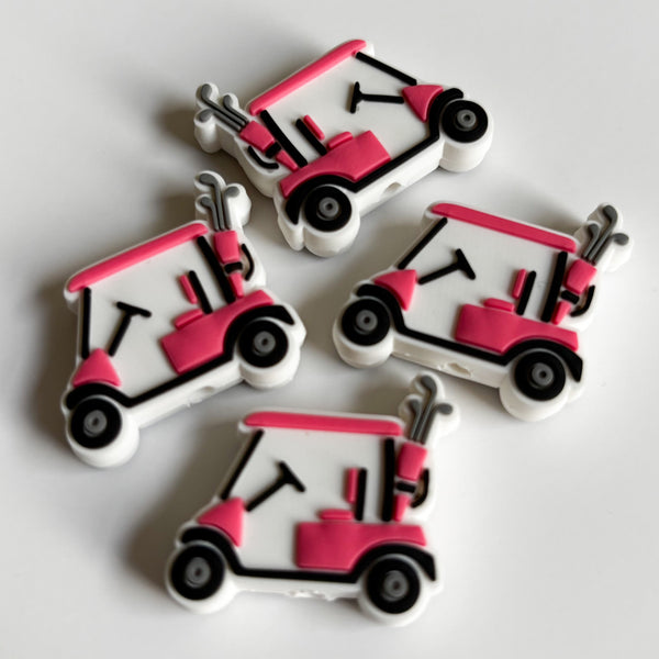 Pink and white golf cart-shaped objects on a light gray background